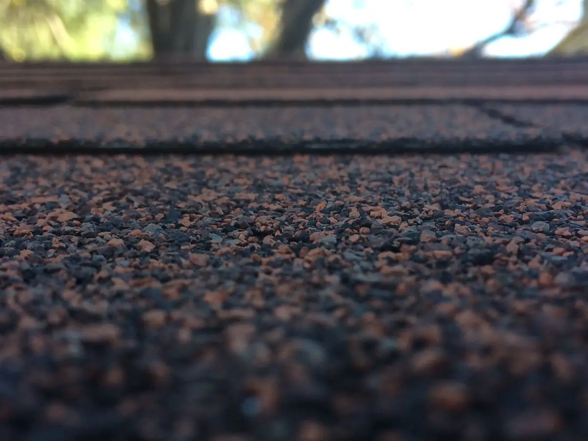 Close-up of layered asphalt shingle courses on a residential roof